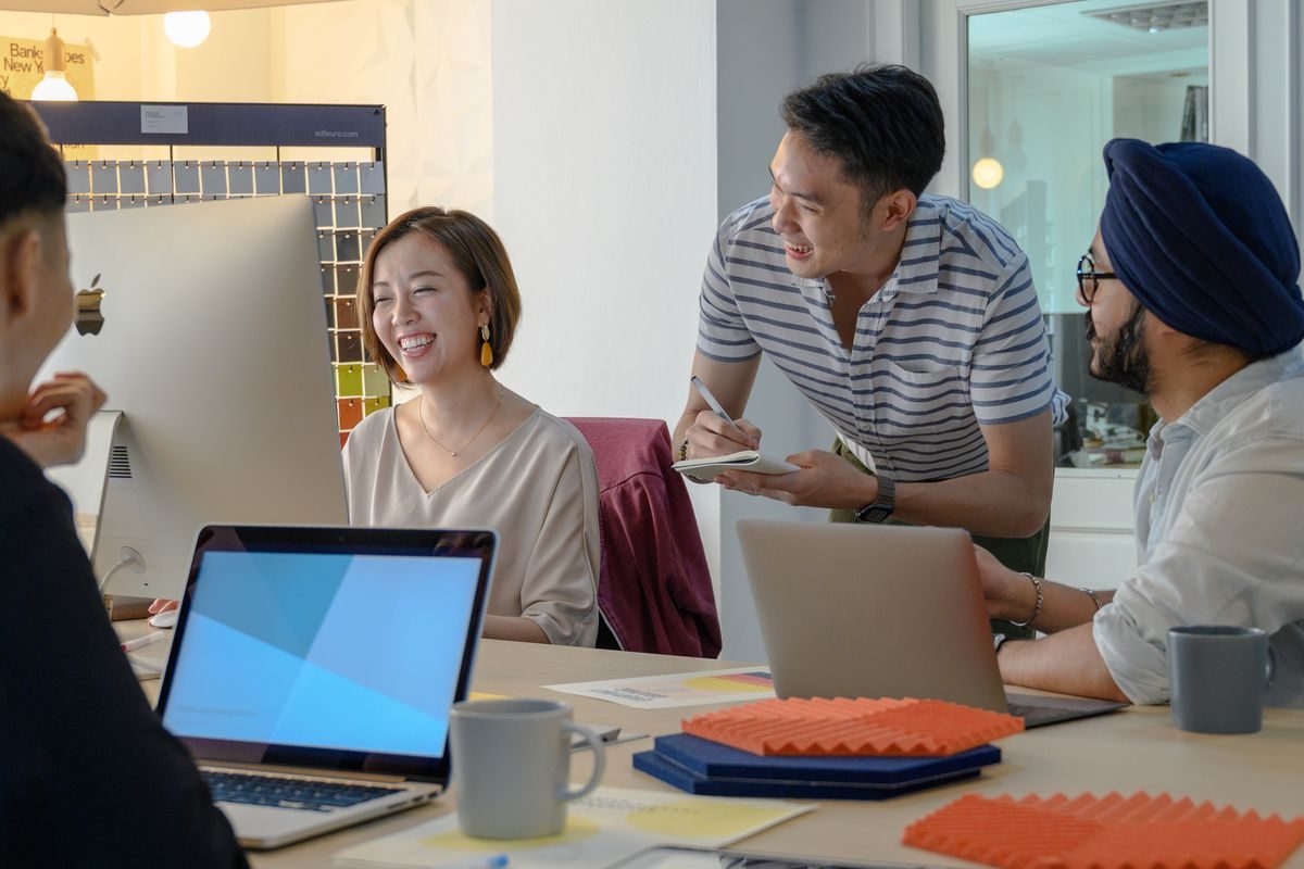 Colleagues working at a shared desk